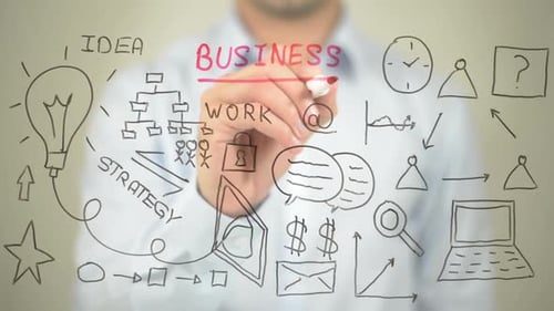 Sketching Business Ideas on Glass Board