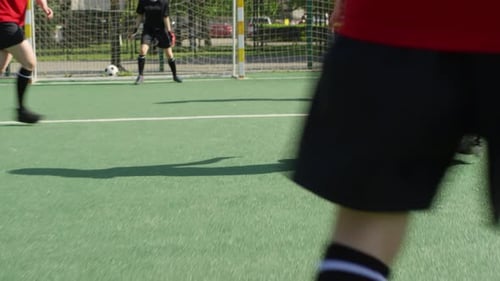 Girls Playing Soccer on Green Field