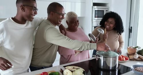 Happy Family Cooking Together in the Kitchen