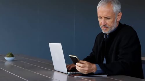 Businessman using mobile phone in hotel 4k