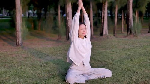 Asian woman outdoor yoga keep calm and meditate while practicing yoga