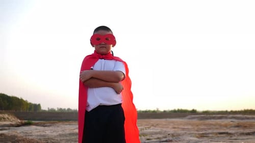 superhero boy running on the field