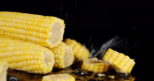 Pieces of Fresh Corn Fall on the Water Splashes.