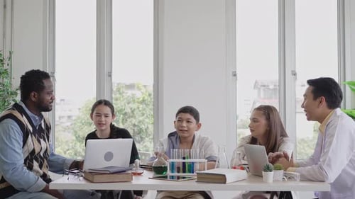 Students Learning Science in Bright Classroom with Teachers