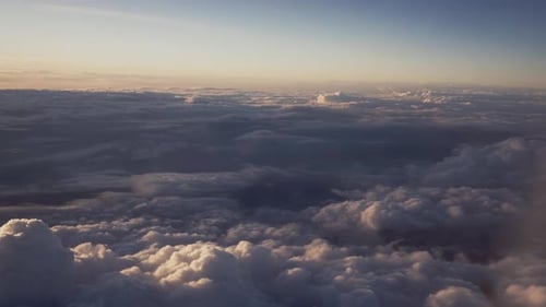 View of white clouds in blue sky from above