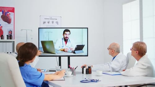 Doctors Discussing Telehealth Medicine During Video Conference