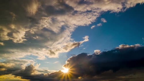 Dramatic Clouds Moving Across Sky at Sunset