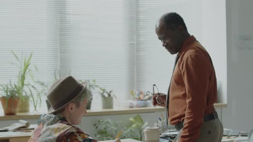 Teacher Lectures Students in a Bright Classroom