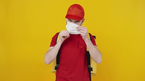 Young Adult Puts on a Face Mask