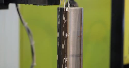Automated Machine Sparks Design on Metal Rod