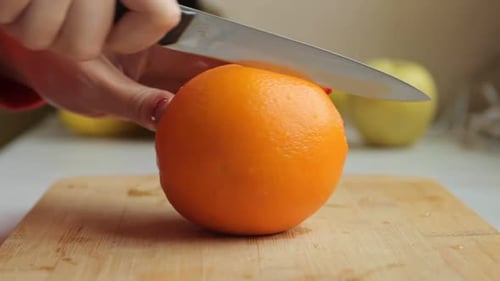 Cutting a Fresh, Juicy Orange in Half