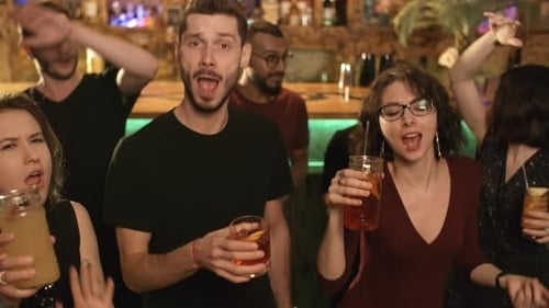 Friends Cheering with Drinks in a Lively Bar