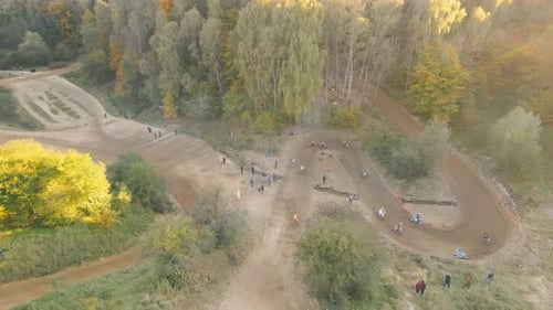 Motorcyclists Make a Sharp Turn During a Motocross Race