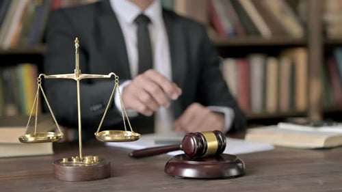Close Up Shoot of Judge Hand Banging the Gavel in Court Room