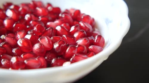 Slice of Pomegranate in a Bowl on Table