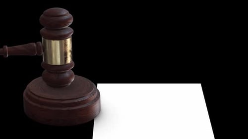 Wooden Gavel Strikes Block Revealing Document