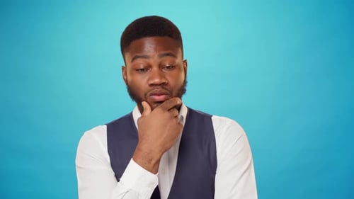 Man Thinking with Hand on Chin Close Up