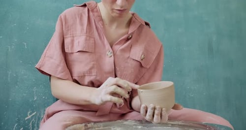 Young Woman Creating a Clay Pottery Bowl