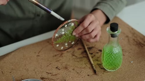 Woman Fixes Glass Plates
