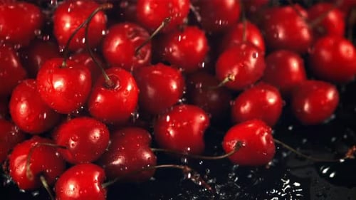 Super Slow Motion on the Fresh Cherry Droplets of Water with Splashes