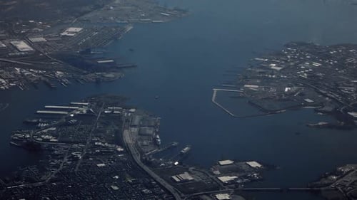 Quick Pan as a Fly over a Industrial Harbor in this Aerial Shot