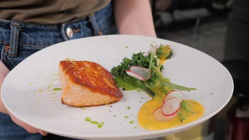 Salmon and Vegetable Dish Served in Restaurant