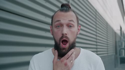 Adult Man Exhibiting Variety of Facial Expressions
