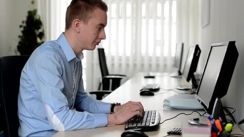 Man Works on Desktop Computer in the Office - Typing on Keyboard