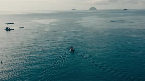Aerial view moving fishing boat at the ocean