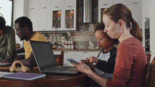 Family Working Together in a Bright Modern Kitchen