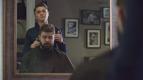 Man Getting Haircut at Barber Shop