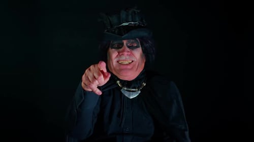 Smiling Man in Costume Gesturing Theatrically