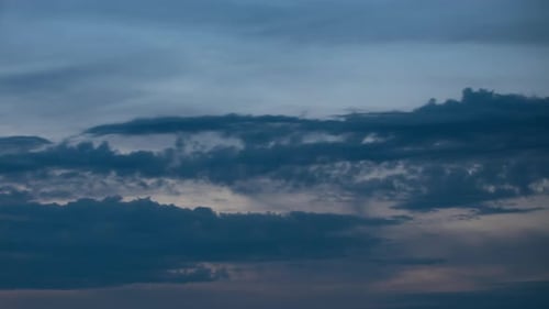 Fluffy Clouds Moving Fast in Time-lapse From Evening To Night. Sunset. Idyllic Cloudy Heaven