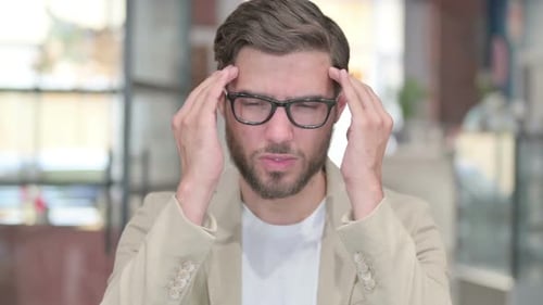 Adult Man Experiencing Headache Symptoms