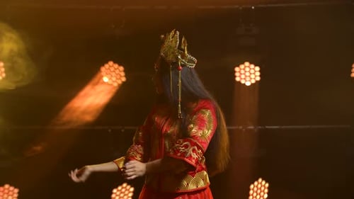Theatrical Performance Woman Dancer in Red Silk Costume and Headdress of a Chinese princess.China