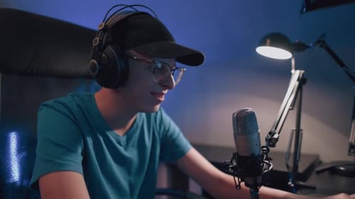 Young Adult Live Streaming with Microphone at Night