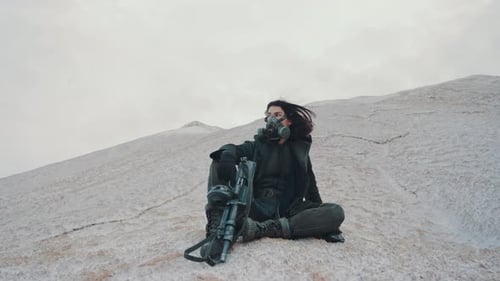 Wide Angle Following Shot Post Apocalyptic Woman in Black Mantle and Grunge Protective Gas Mask