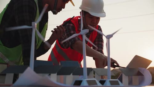 Asian engineer, foreman or leader discussion about home solar cell farm