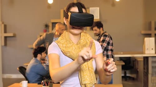 Woman Experiences Virtual Reality in Modern Office