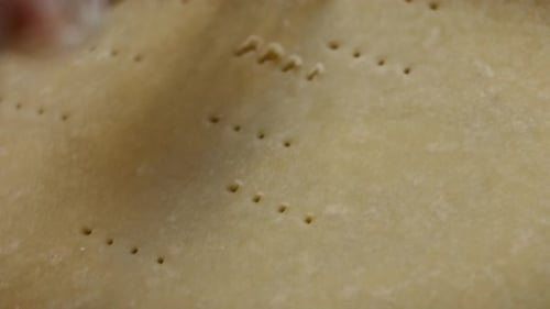 Fork Piercing Pie Dough for Cooking Project