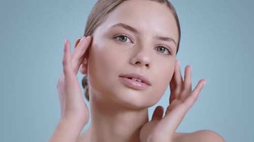 Woman Massaging Her Face in Beauty Shot