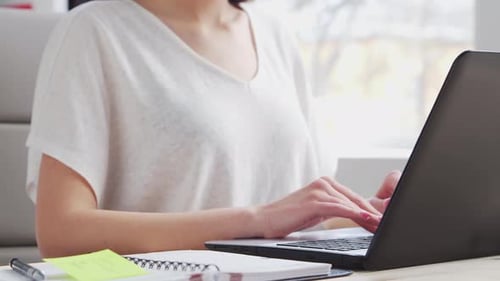 Young Woman Works at Home Office Using Computer.