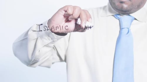 Man Writes Islamic Banking on Clear Surface