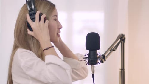Woman Recording a Podcast in Home Studio