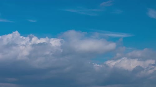 Fluffy Cumulus White Clouds Moving Fast in Timelapse