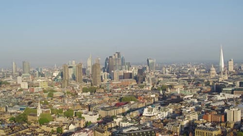 slow pan right reveal aerial establishing shot of central London shot from drone
