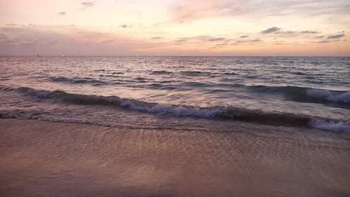 Wonderful Sunset with Ocean Waves on Empty Sandy Beach