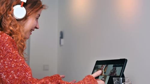 Woman Video Calling on Tablet Device Indoors