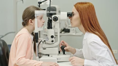 Optometrist Checking Vision of Little Patient
