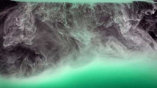White Ink Swirling in Turquoise Liquid